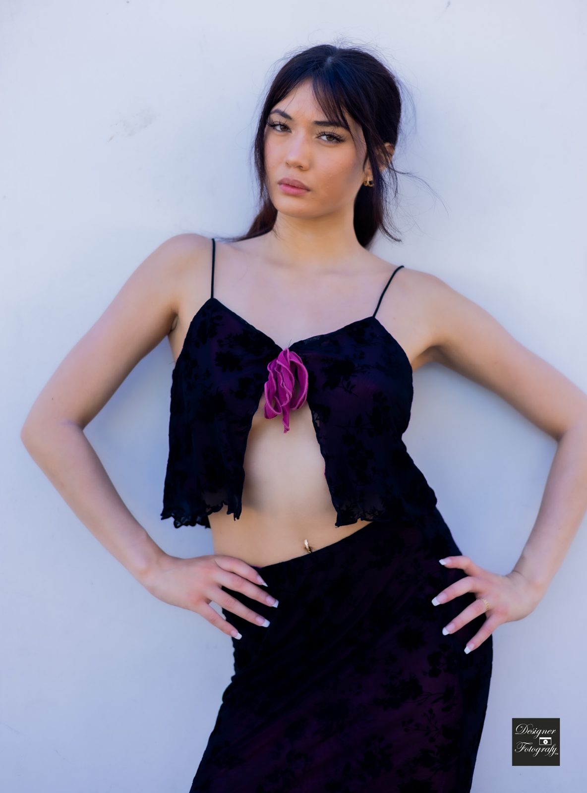 Sam Blair, model, against a white wall